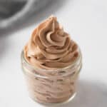 A 4-ounce mason jar filled with piped chocolate whipped cream.