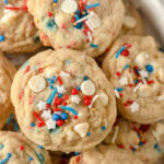 White chocolate chip cookies with red, white, and blue sprinkles.
