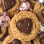 Peanut butter cookies with chocolate hearts pressed into the middle.