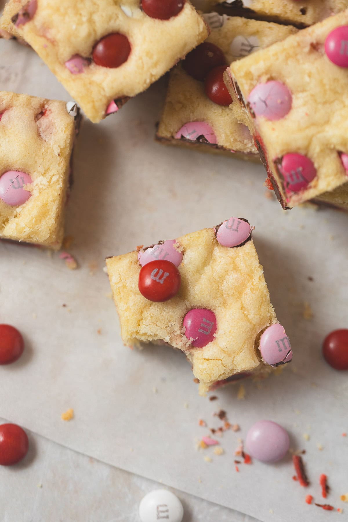 Valentine's M&Ms Cookie bars--one with a bite removed.