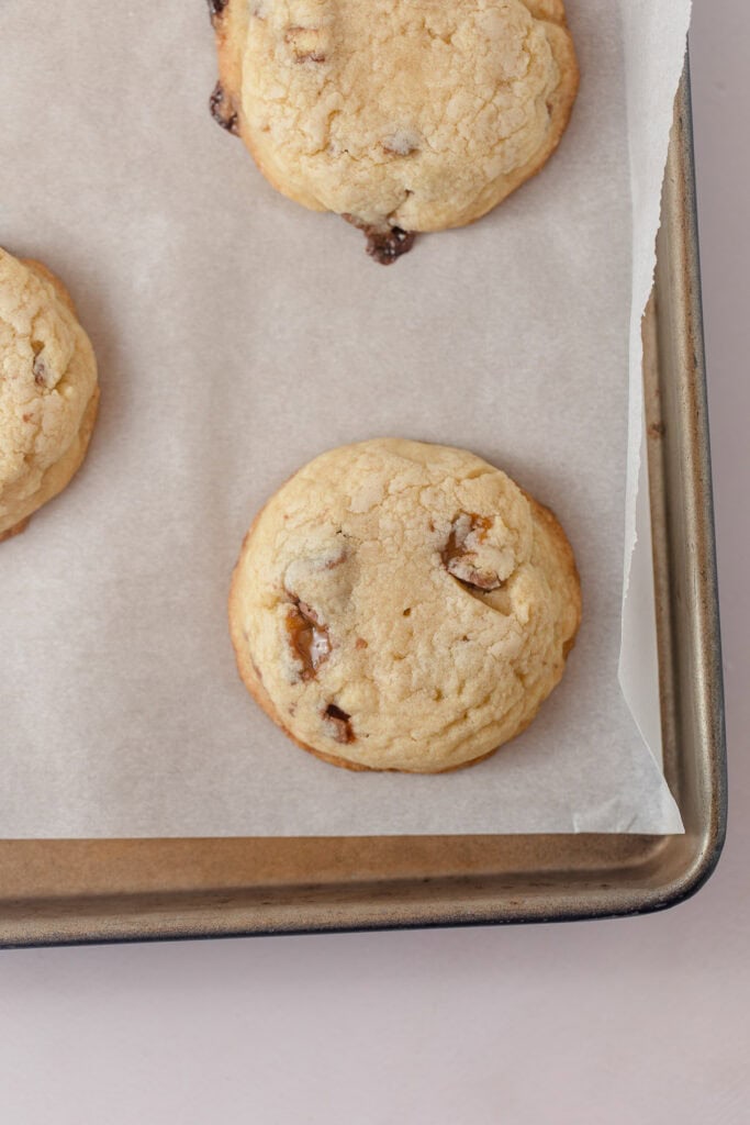 A tray of cookies with Twix candy bar pieces baked in.
