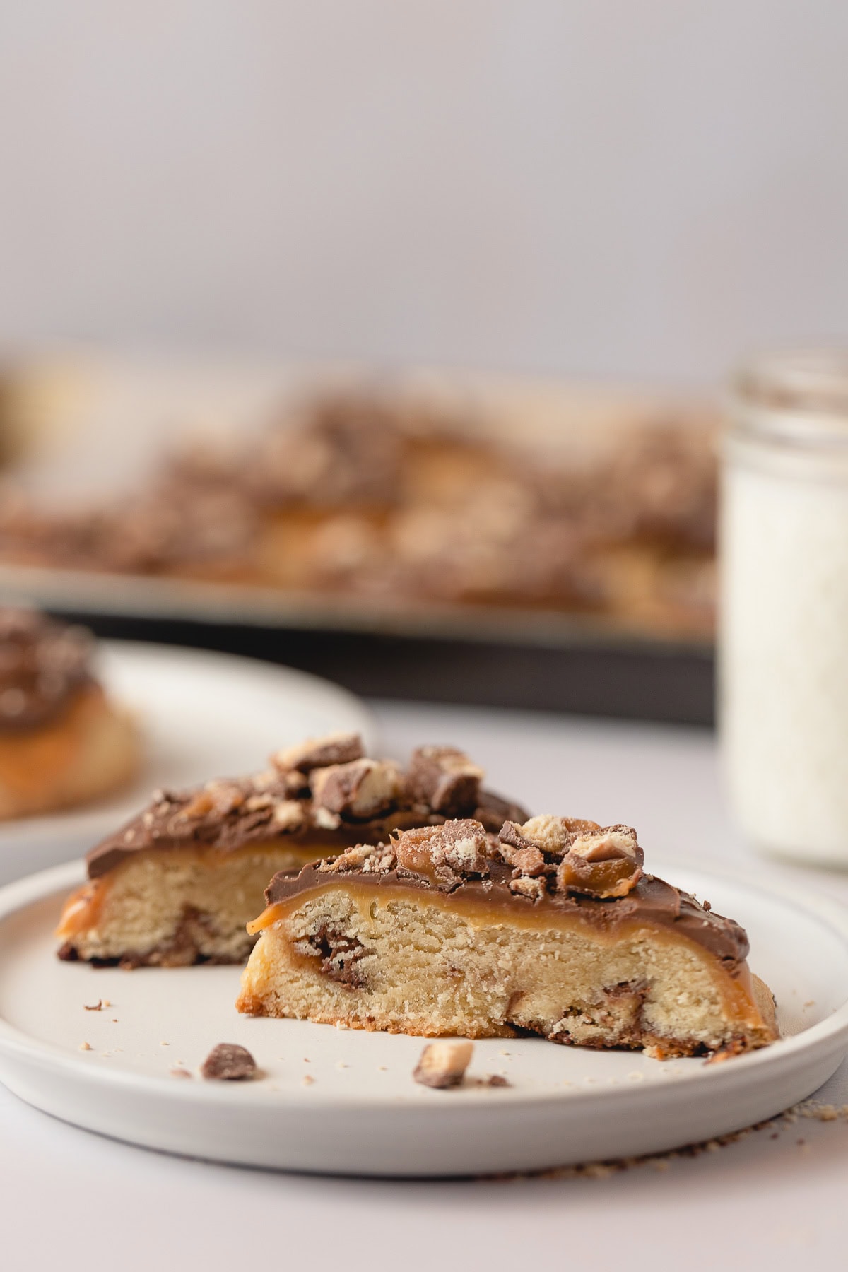 A Caramel Shortbread cookie cut in half and arranged on a plate.