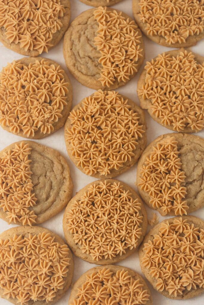 Peanut butter cookies with piped stars of peanut butter buttercream frosting.