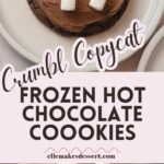 Chocolate cookies decorated with marshmallow and chocolate frosting with the words, "Crumbl Copycat Frozen Hot Chocolate Cookies".
