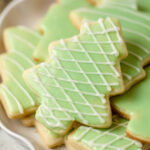 Christmas tree cookies with green and white icing.
