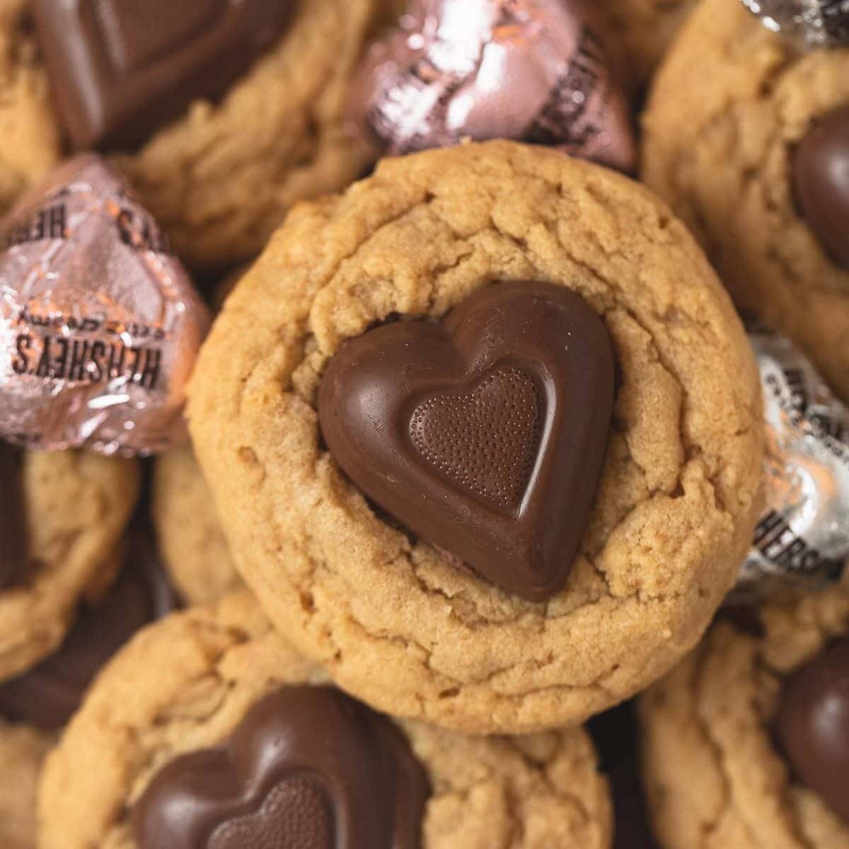 Peanut butter cookies with chocolate hearts pressed into the middle.