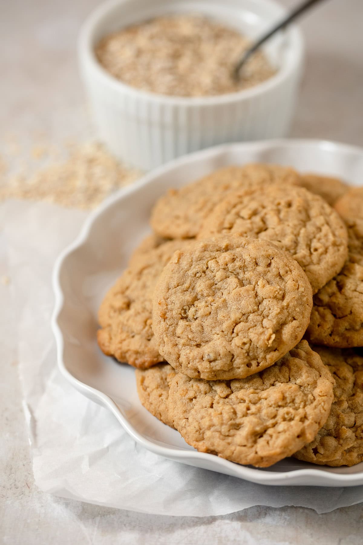A white plate filled with homemade oatmeal peanut butter cookies.