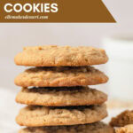 Five cookies in a stack on crinkled parchment paper with the words, "Oatmeal Peanut Butter Cookies".